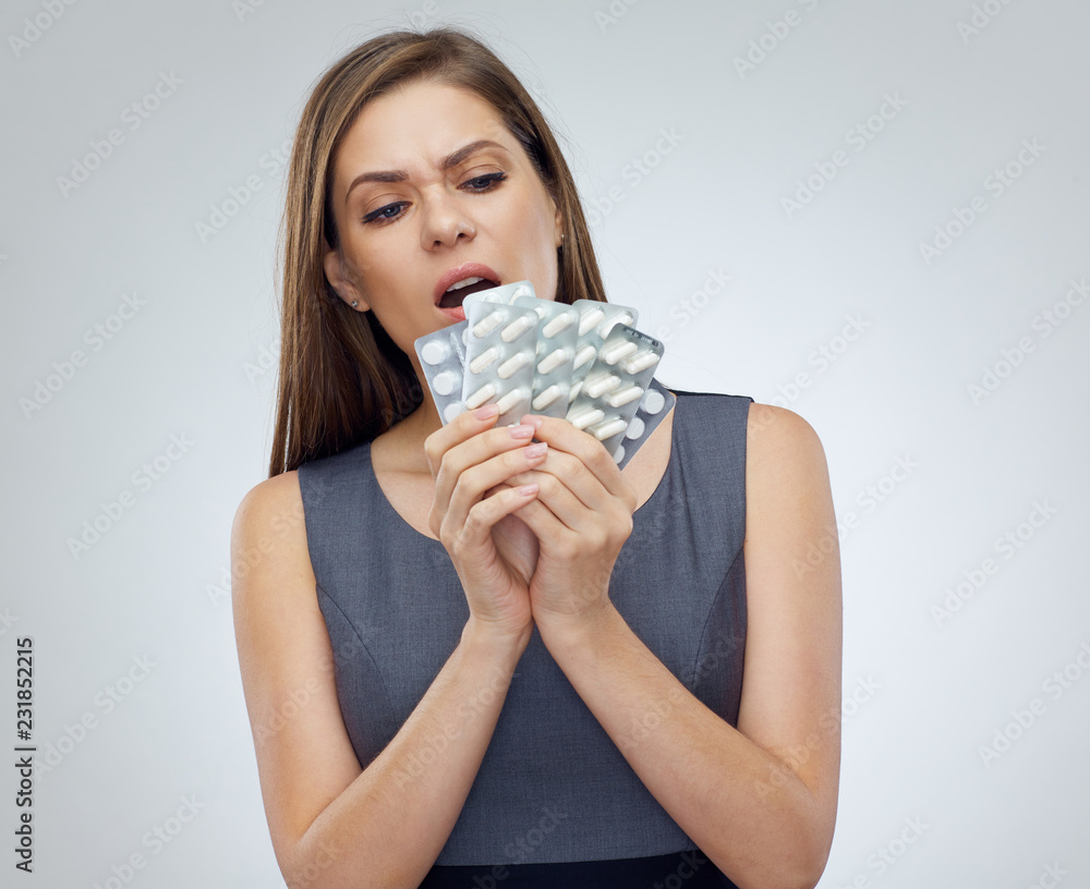 Woman holding vitamin pills isolated Woman holding vitamin pills isolated