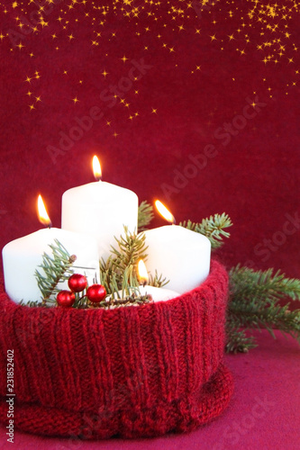 Christmas and New Year advent candles with a burning flame concept