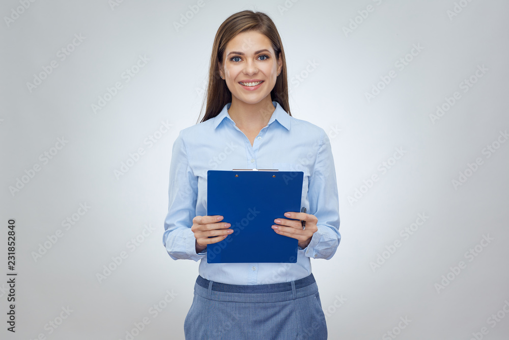 Smiling happy business woman holding clip board with pen.