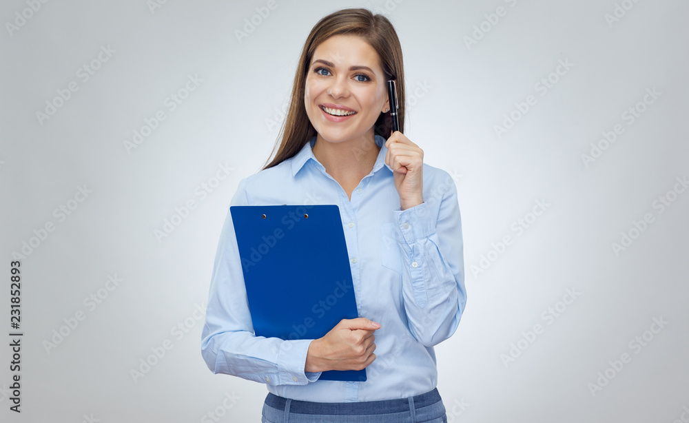 Smiling happy business woman holding clip board with pen. Smiling happy business woman holding clip board with pen.