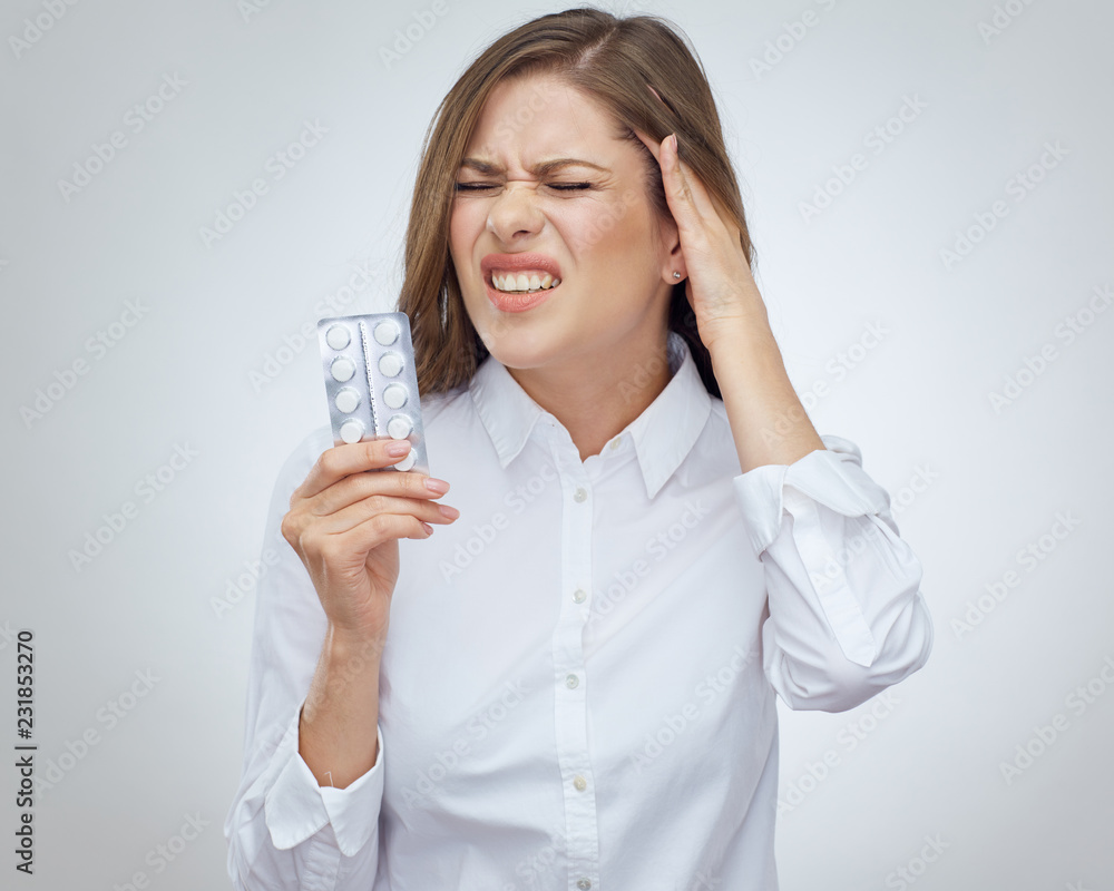 Woman with pills touch head. Woman with pills touch head.