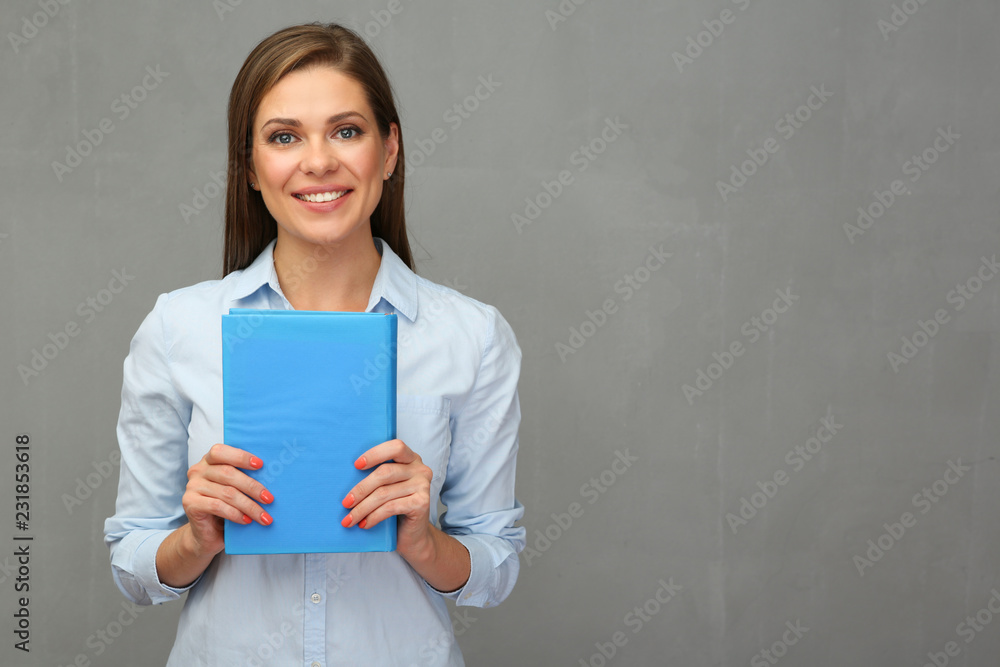 Woman teacher holding book. Woman teacher holding book.