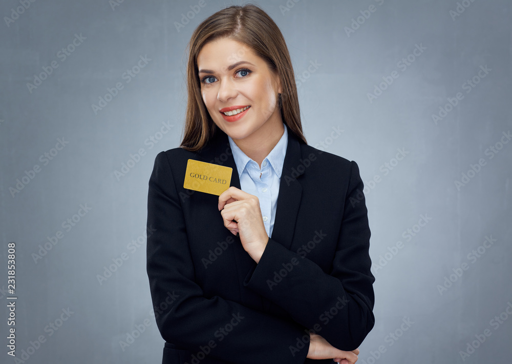 Smiling woman bank employee holding gold credit card Smiling woman bank employee holding gold credit card
