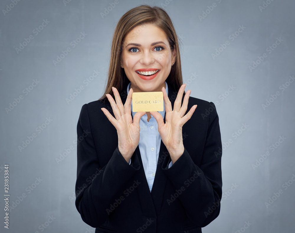 Woman smiling with tooth holding gold credit card. Woman smiling with tooth holding gold credit card.