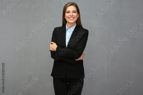 Smiling business woman with crossed arms