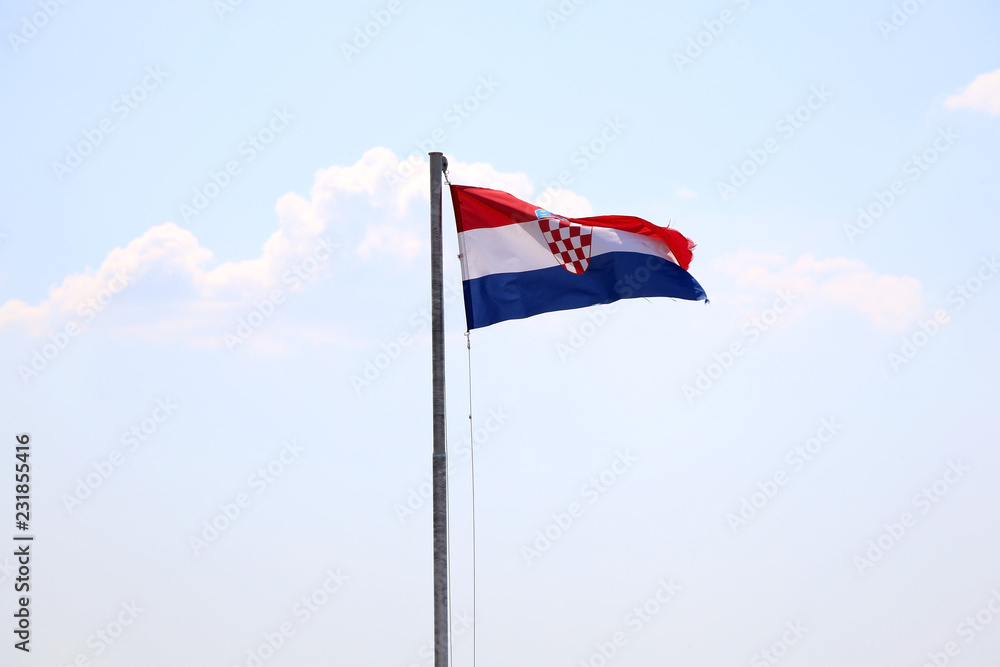Flag of Croatia, blowing in the wind. Sky in the background, selective focus.
Flag of Croatia, blowing in the wind. Sky in the background, selective focus.