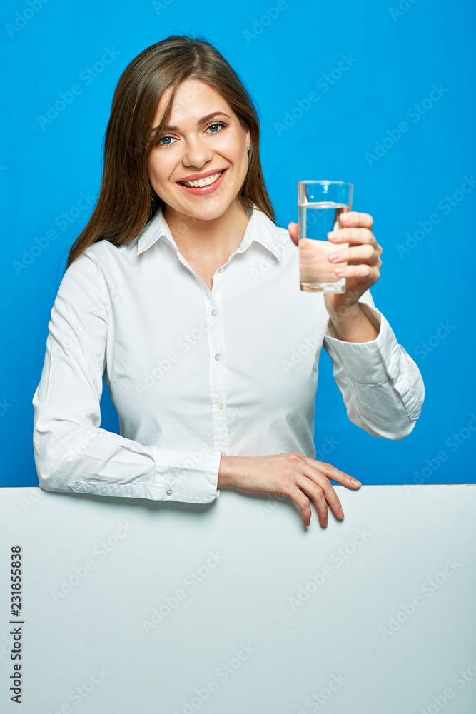 Smiling woman in white shirt holding water glass with blak card, Smiling woman in white shirt holding water glass with blak card,