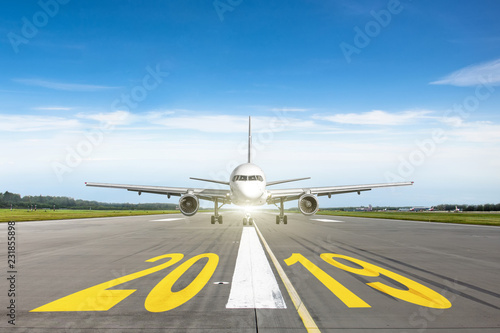 The inscription on the runway 2019. The concept of travel in the new year, holidays.