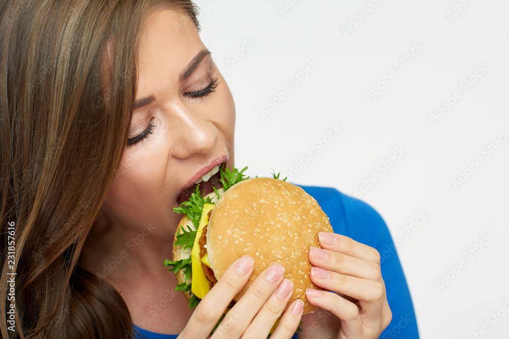 Close up portrait of woman eating cheeseburger Close up portrait of woman eating cheeseburger