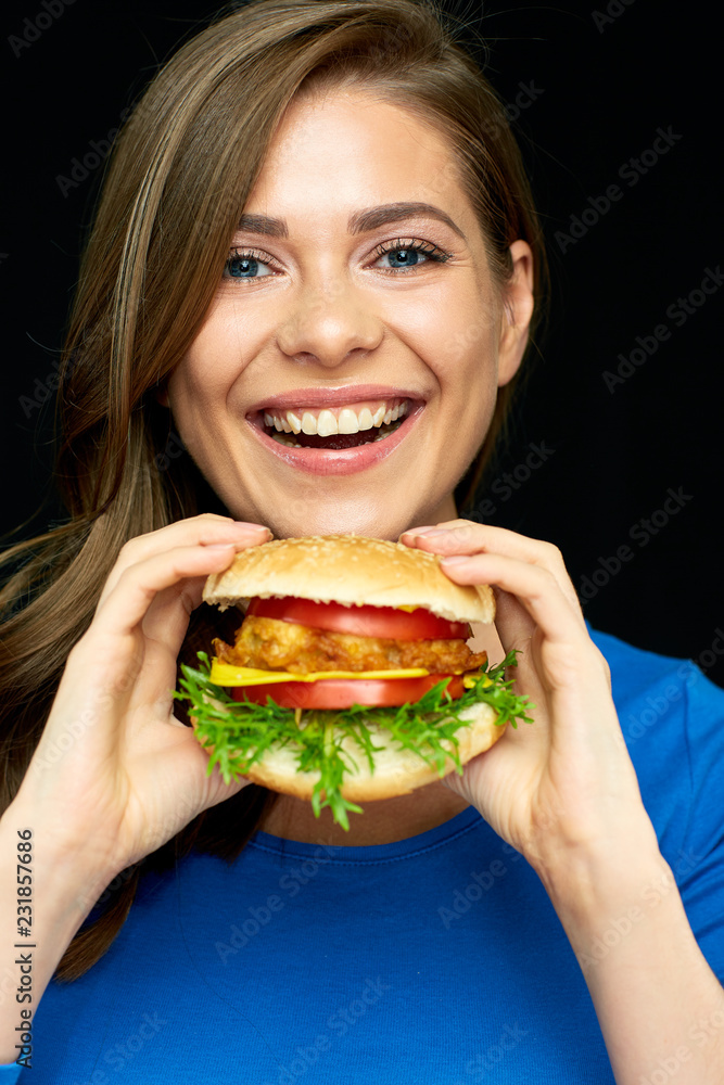 Woman eat burger. Close up face portrait Woman eat burger. Close up face portrait