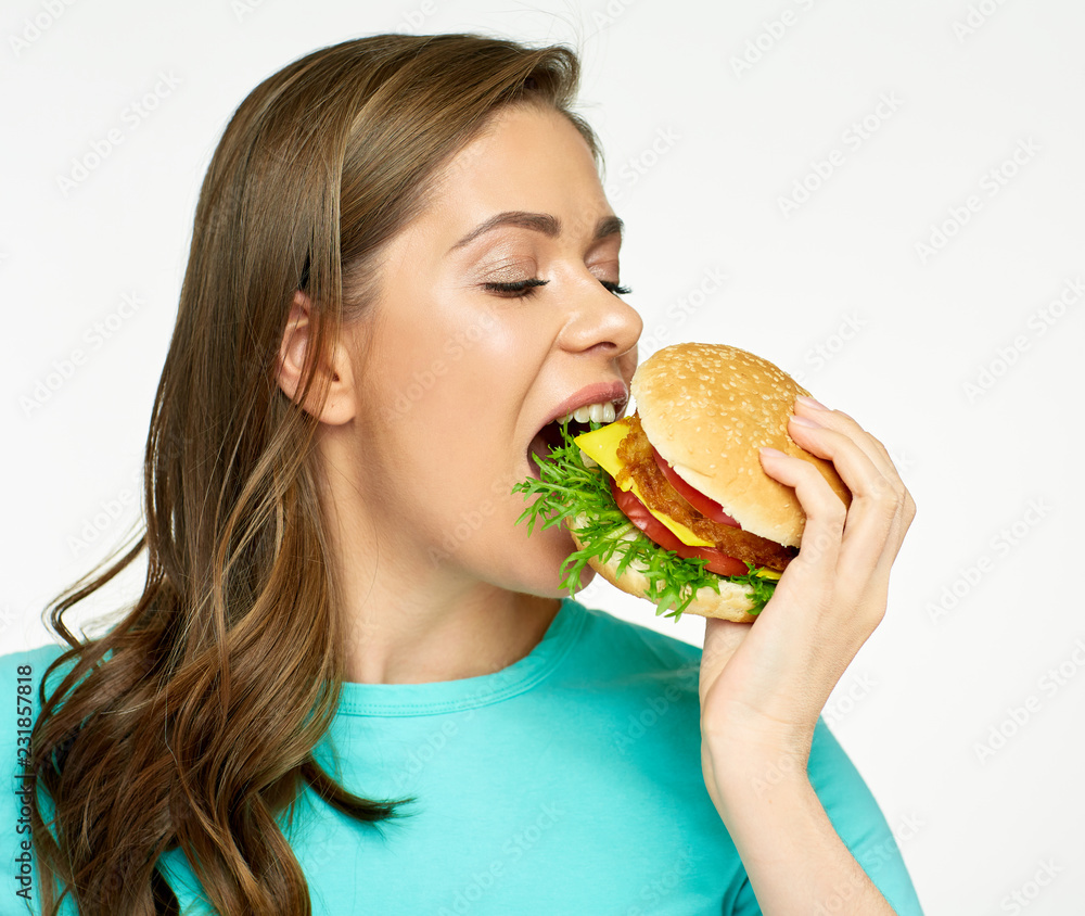 Woman eat burger. Close up face portrait