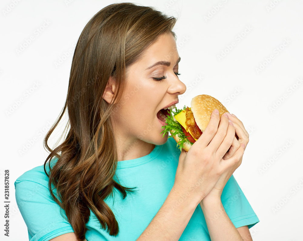 Woman eating fast food meal burger.