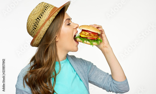 Woman eat burger. Close up face portrait
