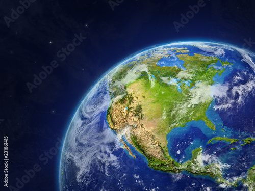 North America on model of planet Earth with very detailed planet surface and clouds.