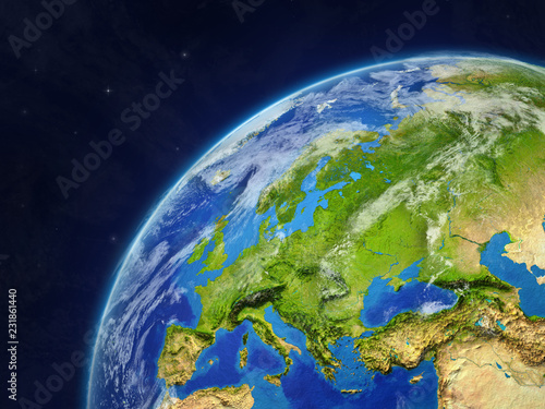 Europe on model of planet Earth with very detailed planet surface and clouds.