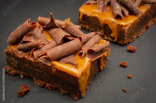 Chocolate Brownies with salted caramel sauce and chocolate flakes