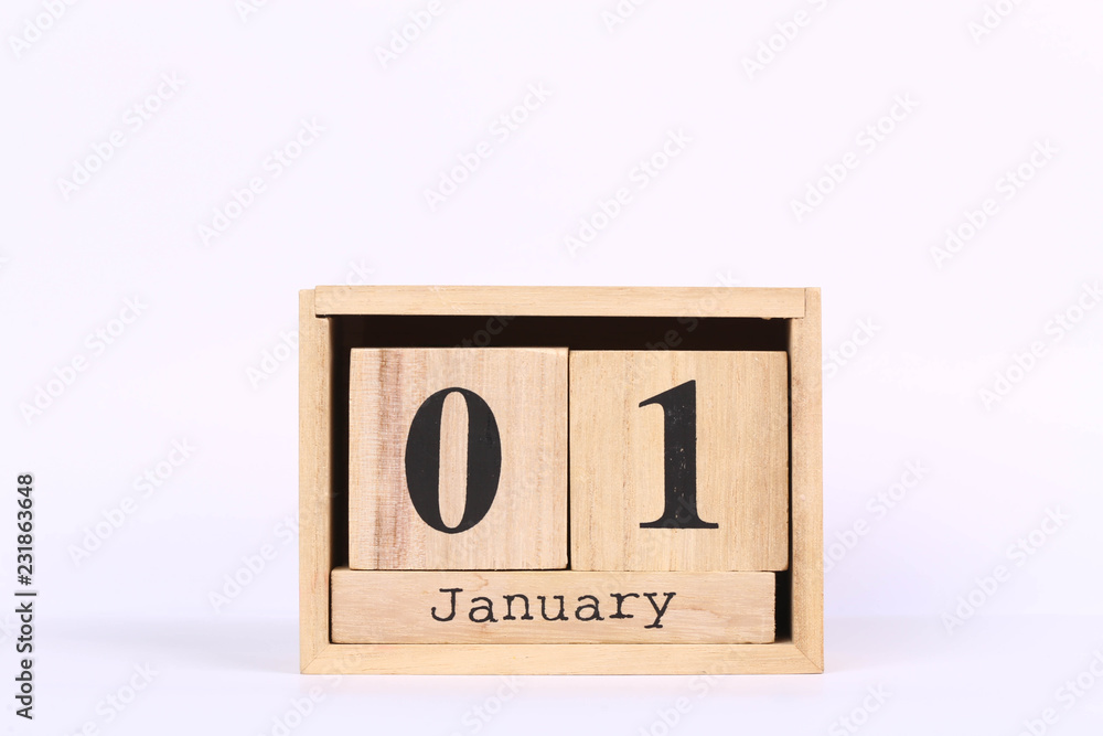 Wooden cubes calendar with the date of January 01. Concept calendar for year with copy space isolated on white background Wooden cubes calendar with the date of January 01. Concept calendar for year with copy space isolated on white background