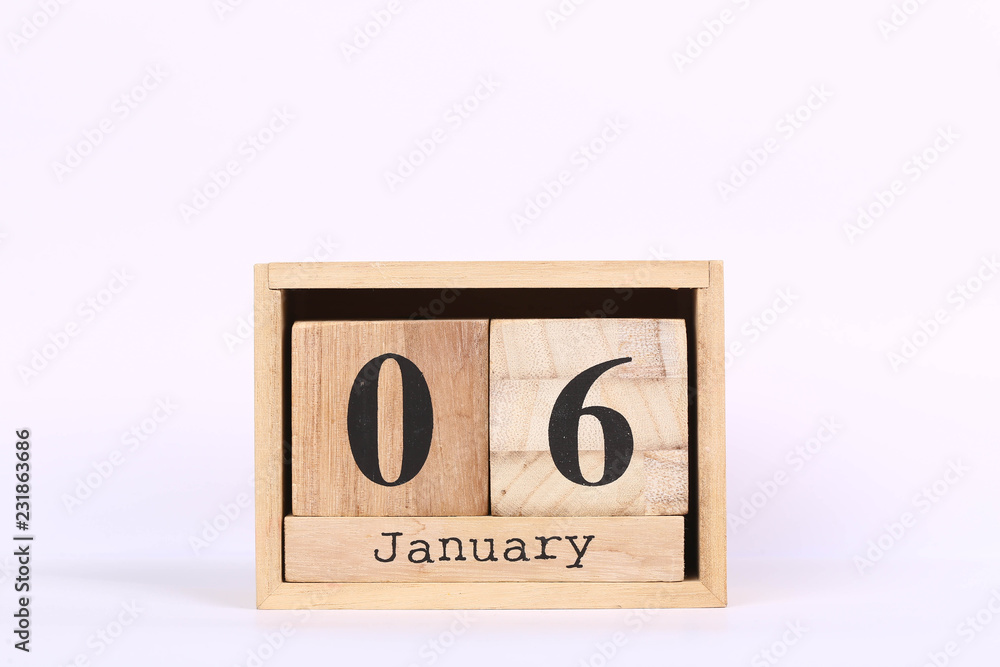 Wooden cubes calendar with the date of January 06. Concept calendar for year with copy space isolated on white background Wooden cubes calendar with the date of January 06. Concept calendar for year with copy space isolated on white background