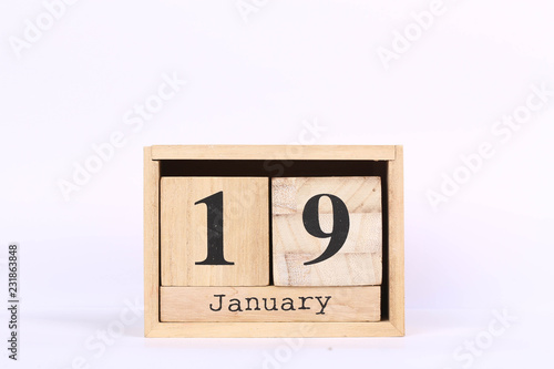 Wooden cubes calendar with the date of January 19. Concept calendar for year with copy space isolated on white background