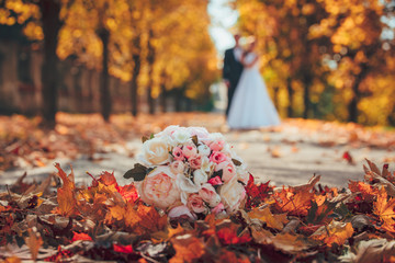 Wedding bouquet and wedding couple in orange park