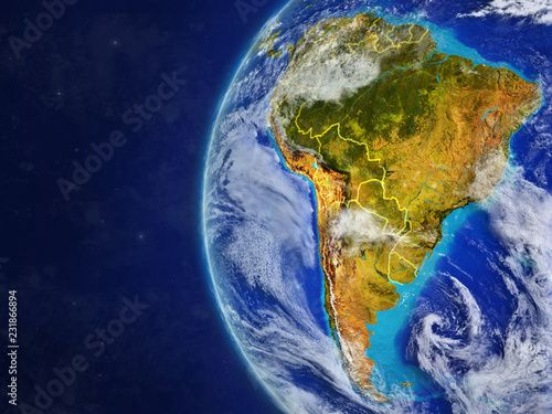 South America from space on model of planet Earth with country borders and very detailed planet surface and clouds.