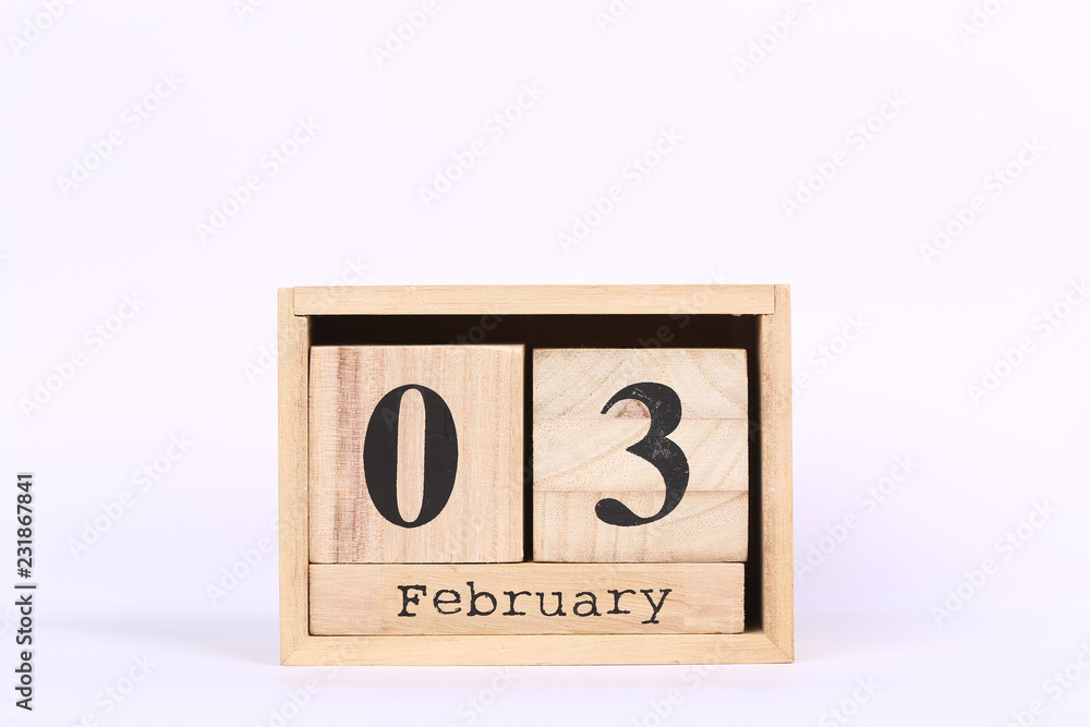 Wooden cubes calendar with the date of February 03. Concept calendar for year with copy space isolated on white background Wooden cubes calendar with the date of February 03. Concept calendar for year with copy space isolated on white background
