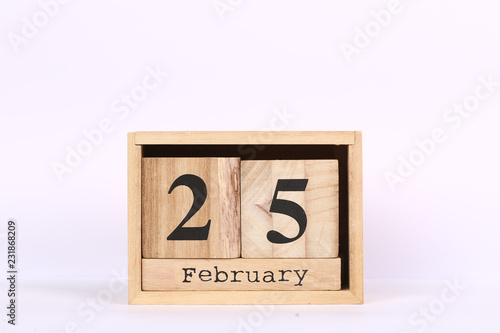 Wooden cubes calendar with the date of February 25. Concept calendar for year with copy space isolated on white background