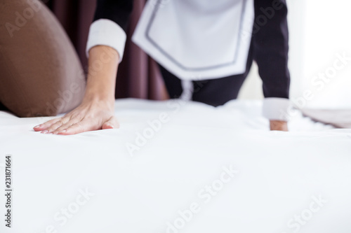 Its perfect. Selective focus of a female hand touching the bed while checking how it is made