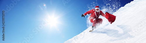 Weihnachtsmann auf dem Snowboard photo