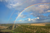 Double rainbow over a valley in Andalusia, Spain near the town of Vejer de la Frontera with breathtaking views over the countryside.