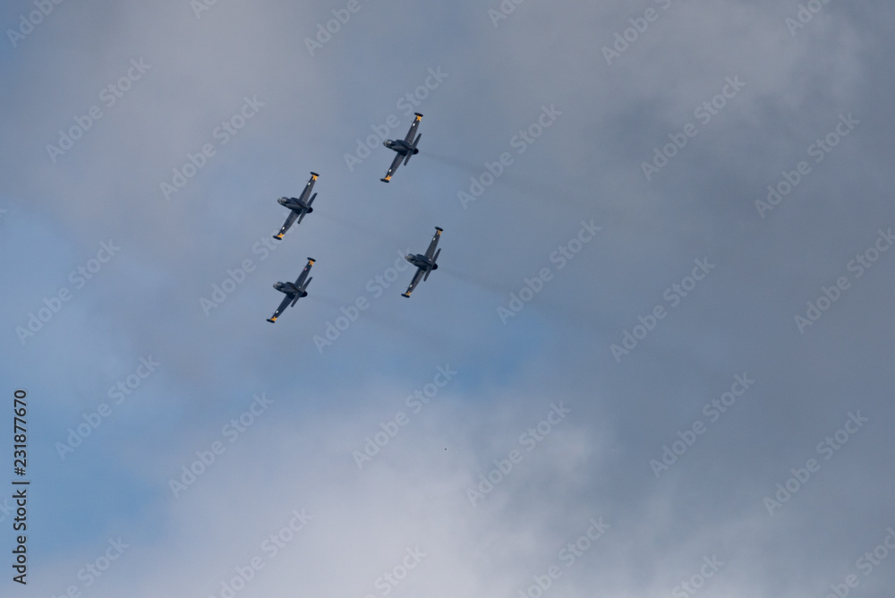 Low angle view of airshow in cloudy sky Low angle view of airshow in cloudy sky