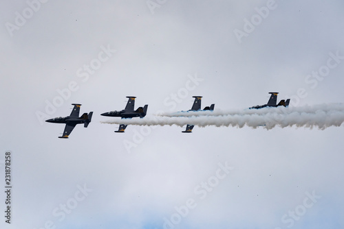 Aerobatic team Russ on aircraft L-39 Albatross performs the program at the air show photo