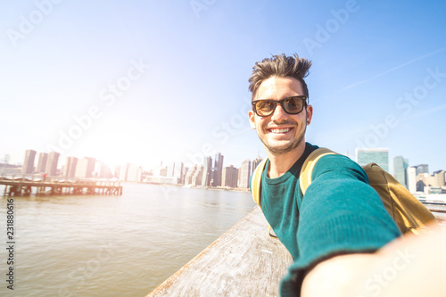 Handsome happy man smiling at the camera taking a selfie at NYC