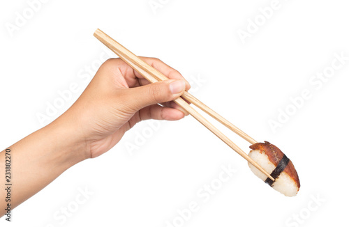Hand holding roll sushi with chopsticks  isolated on white background