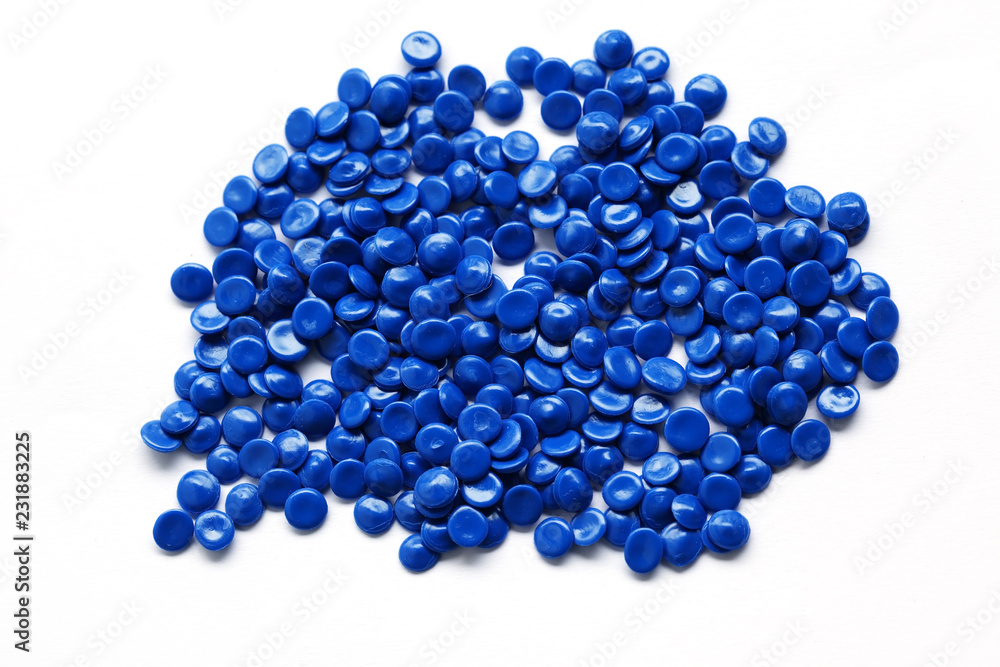 close up of blue industrial plastic pellet on white background close up of blue industrial plastic pellet on white background