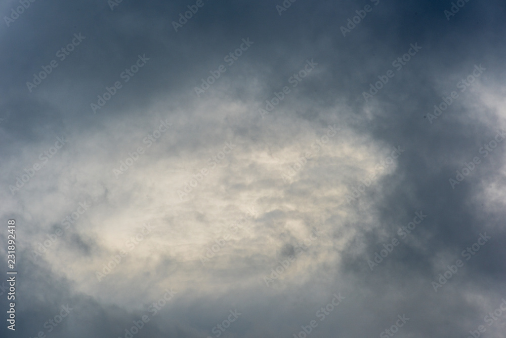 Dramatic cloudy sky with a bright light Dramatic cloudy sky with a bright light
