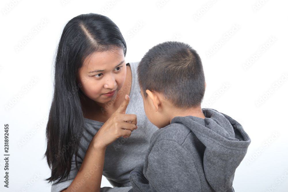 Asian mother scolding his son, isolated on white background. Asian mother scolding his son, isolated on white background.