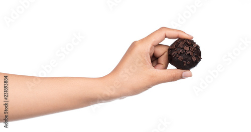 hand holding chocolate ball isolated on a white background