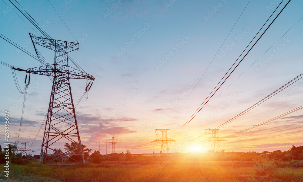 Fototapeta premium High-voltage power lines. Electricity distribution station. high voltage electric transmission tower. Distribution electric substation with power lines and transformers
