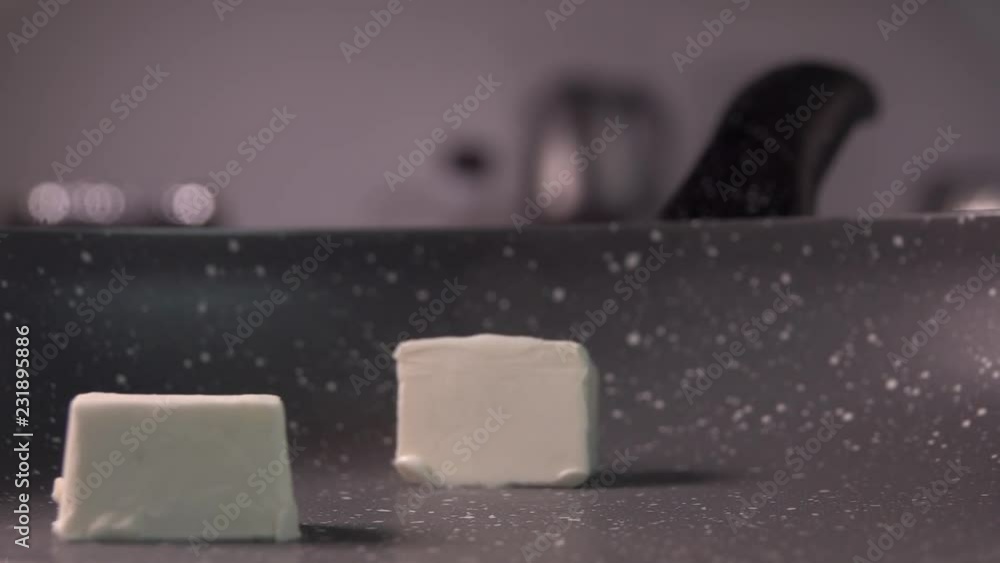 cube of butter fall on frying pan, slow motion, 240 fps cube of butter fall on frying pan, slow motion, 240 fps
