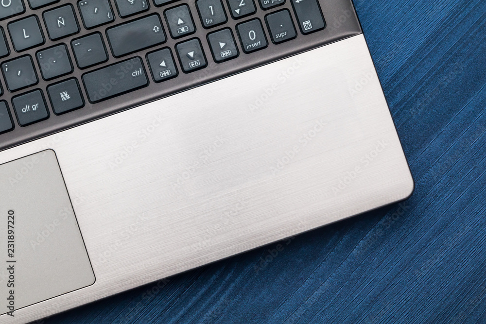 Modern workplace with notebook. Copy space and blue wood background. Top view. Modern workplace with notebook. Copy space and blue wood background. Top view.