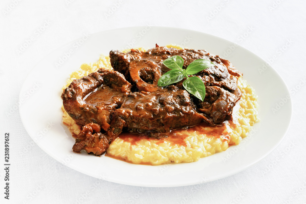 braised with wine and vegetables cross-cut beef shank garnished with risotto