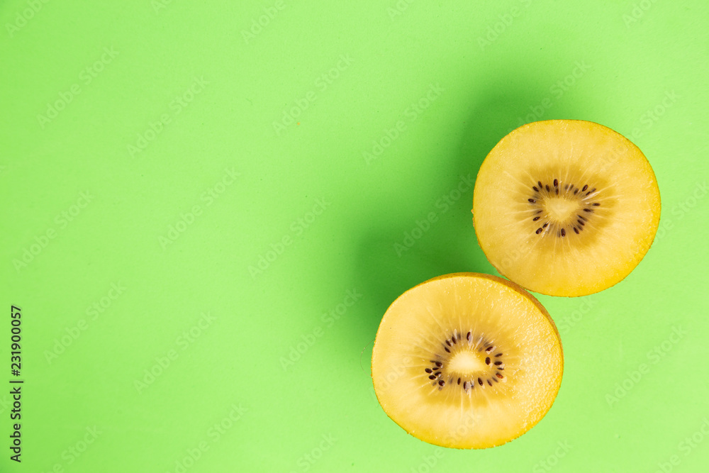 yellow kiwi on colorful background