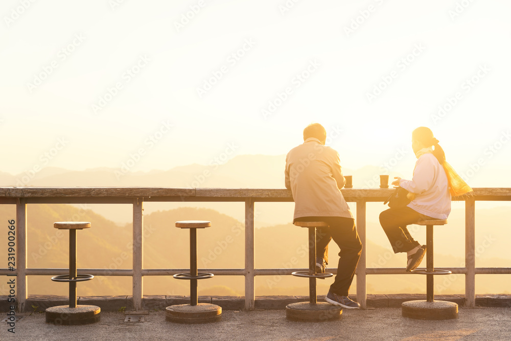 custom made wallpaper toronto digitalCarefree happy lover feeling happy and having coffee watching on top of mountain edge cliff enjoying sunlight .Enjoying nature sunset. Freedom. Enjoyment. Relaxing in mountains at sunrise. Sunshine.