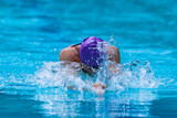 Male swimmer working on his breaststroke at a local swimming pool