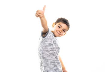 Boy having fun on studio white background