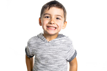 Boy having fun on studio white background