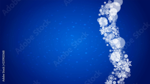 Winter border with white snowflakes for Christmas and New Year celebration. Horizontal winter border on blue background for banners, gift coupon, voucher, ads, party events. Falling frosty snowflakes.