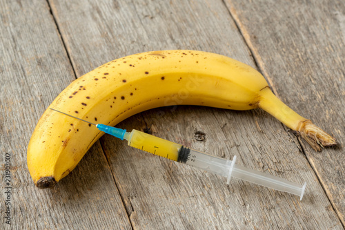 Syringe and banana photo