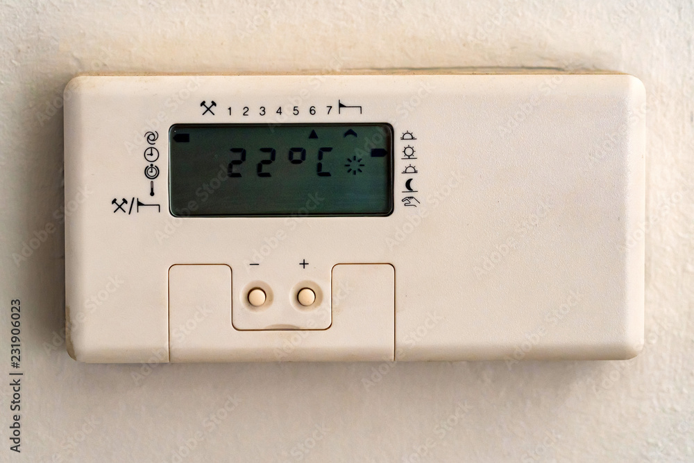 White climate control panel on wall in flat White climate control panel on wall in flat